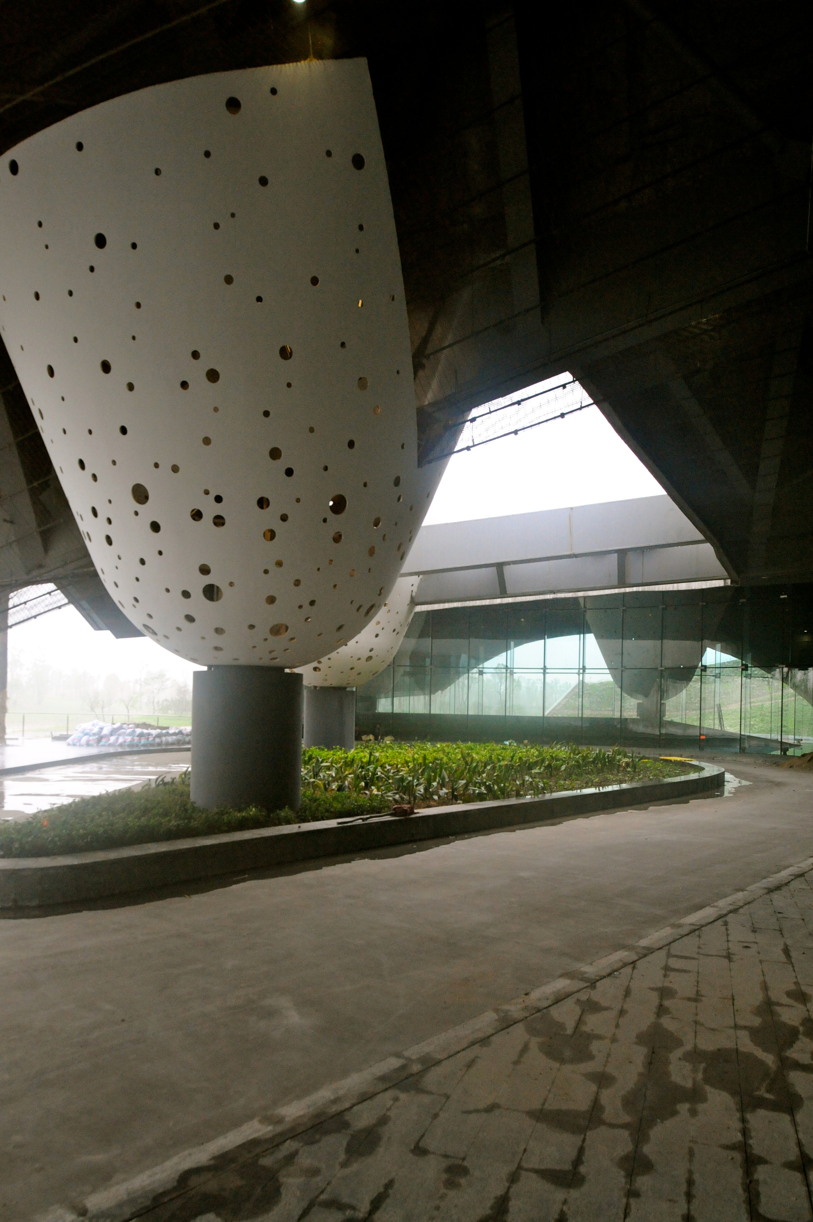 Entry to hotel introduces inverted, rounded conical forms.