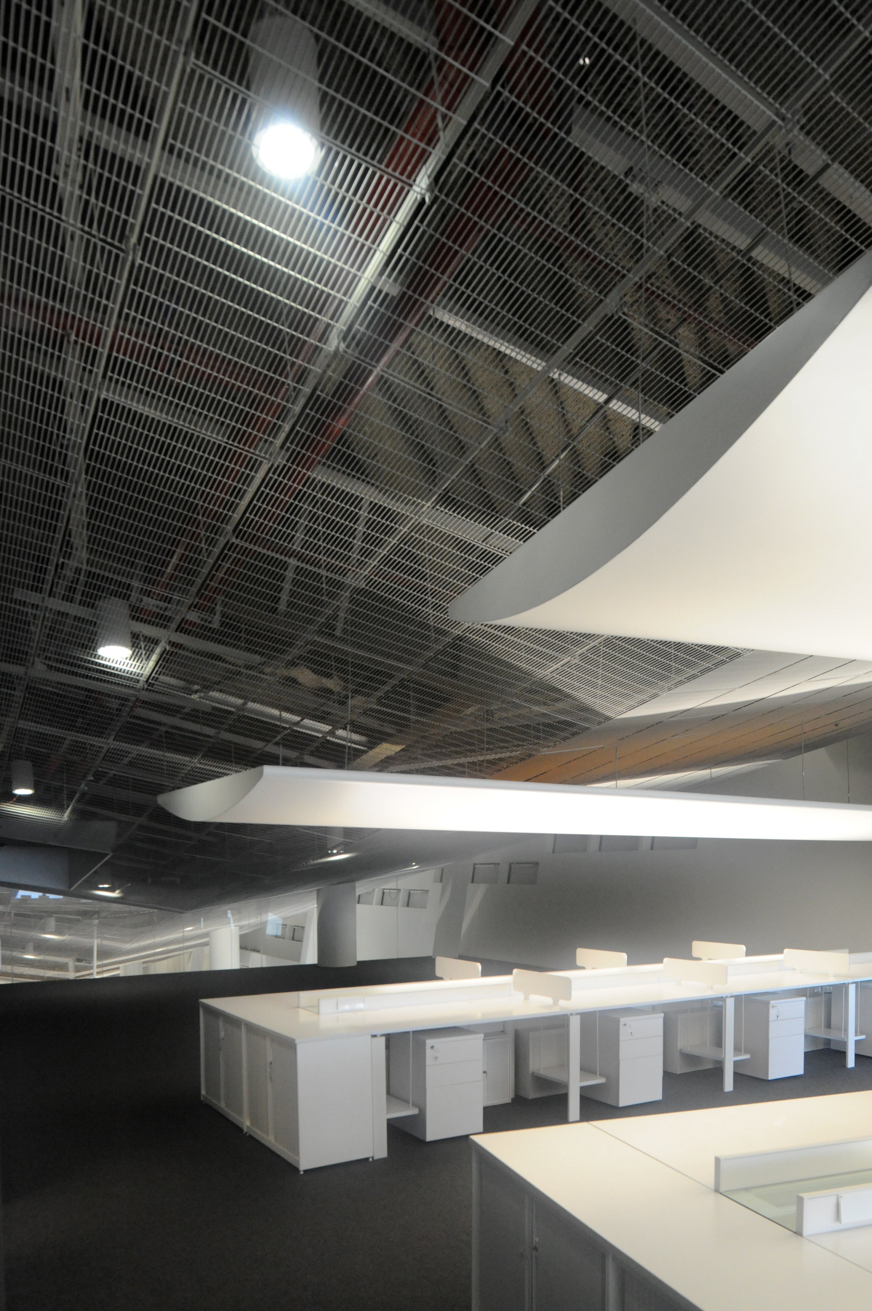 Actual work spaces are clean, orderly and beautifully lit.