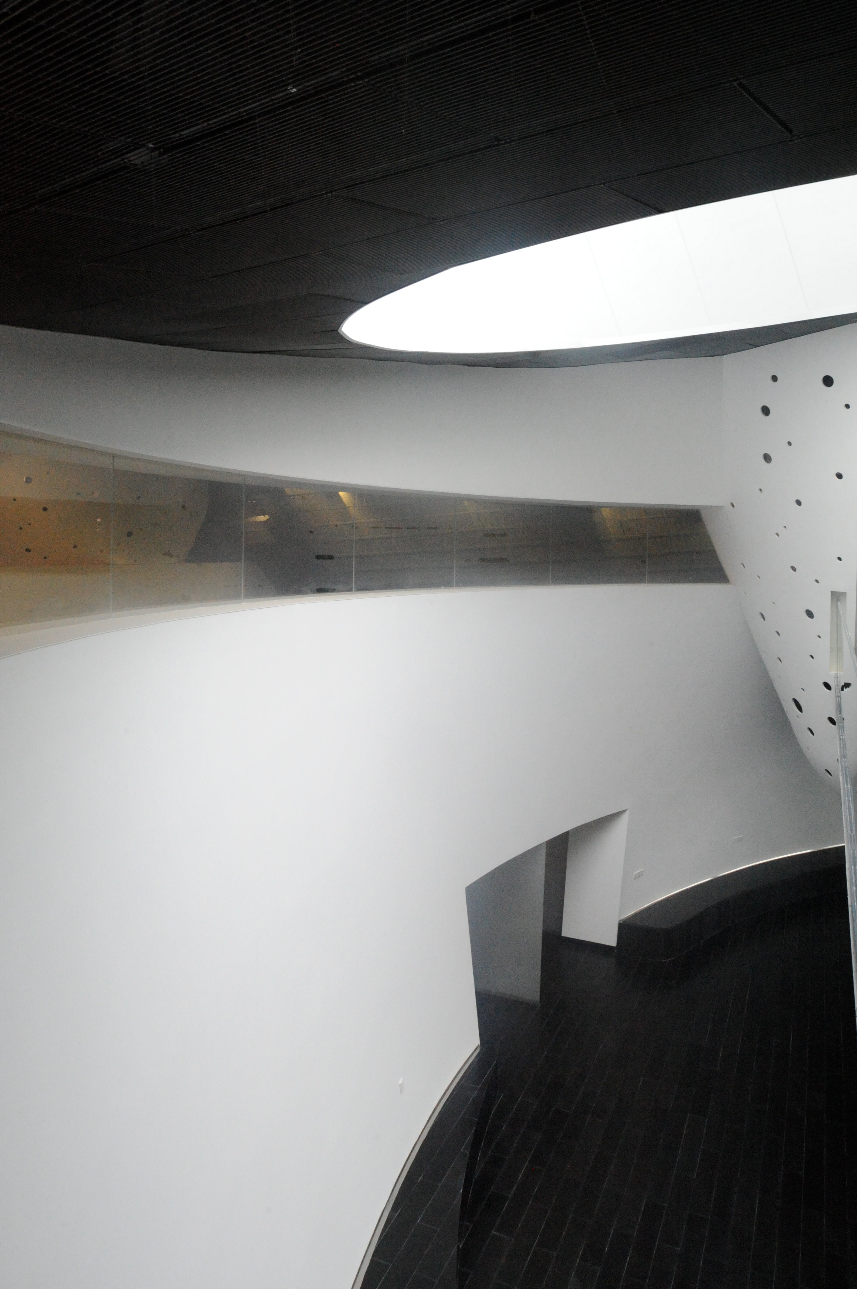 Dramatic contrasts of light and dark animate the fitness center.