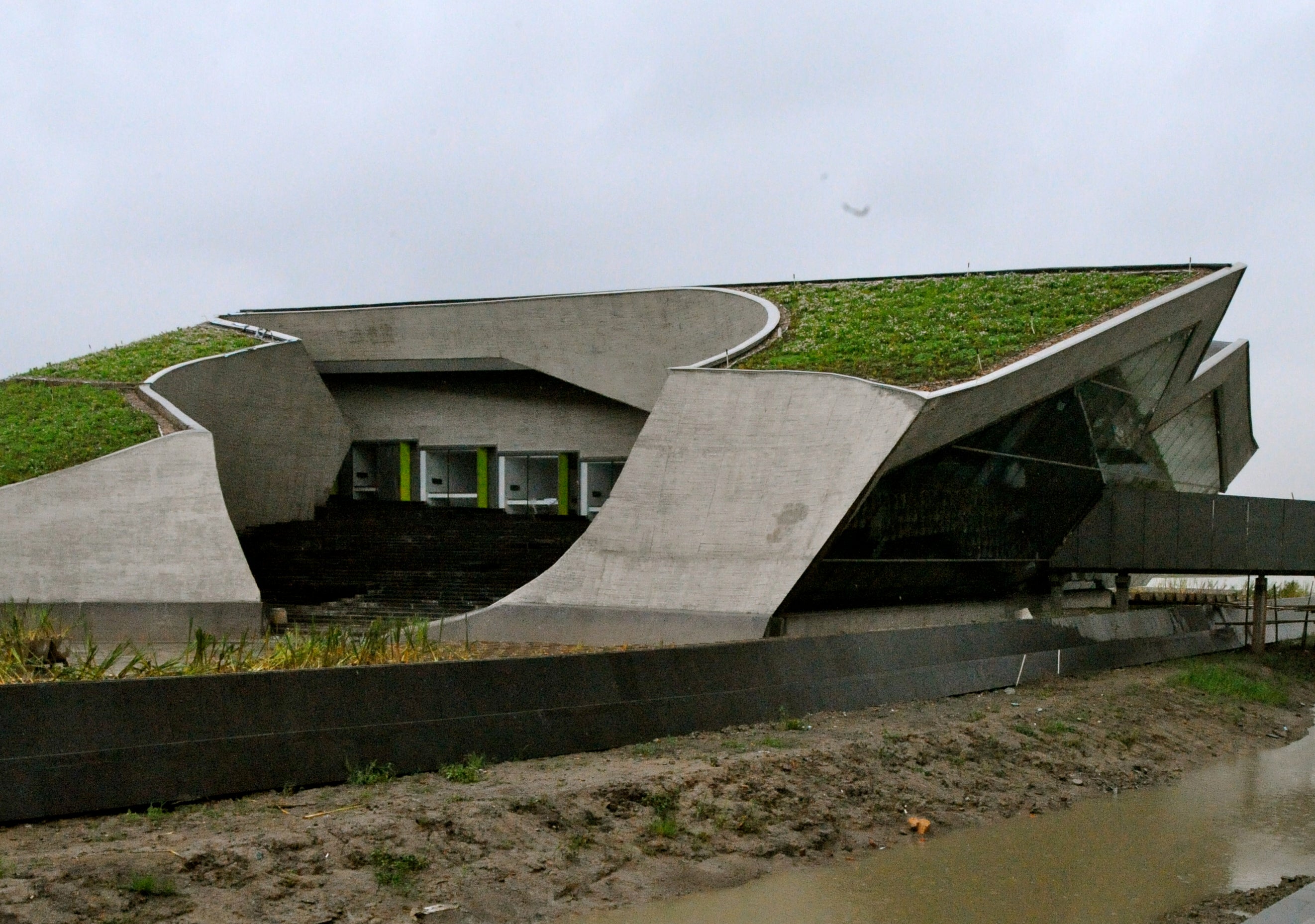Hotel on west side of campus is tucked under a landscape form as well.