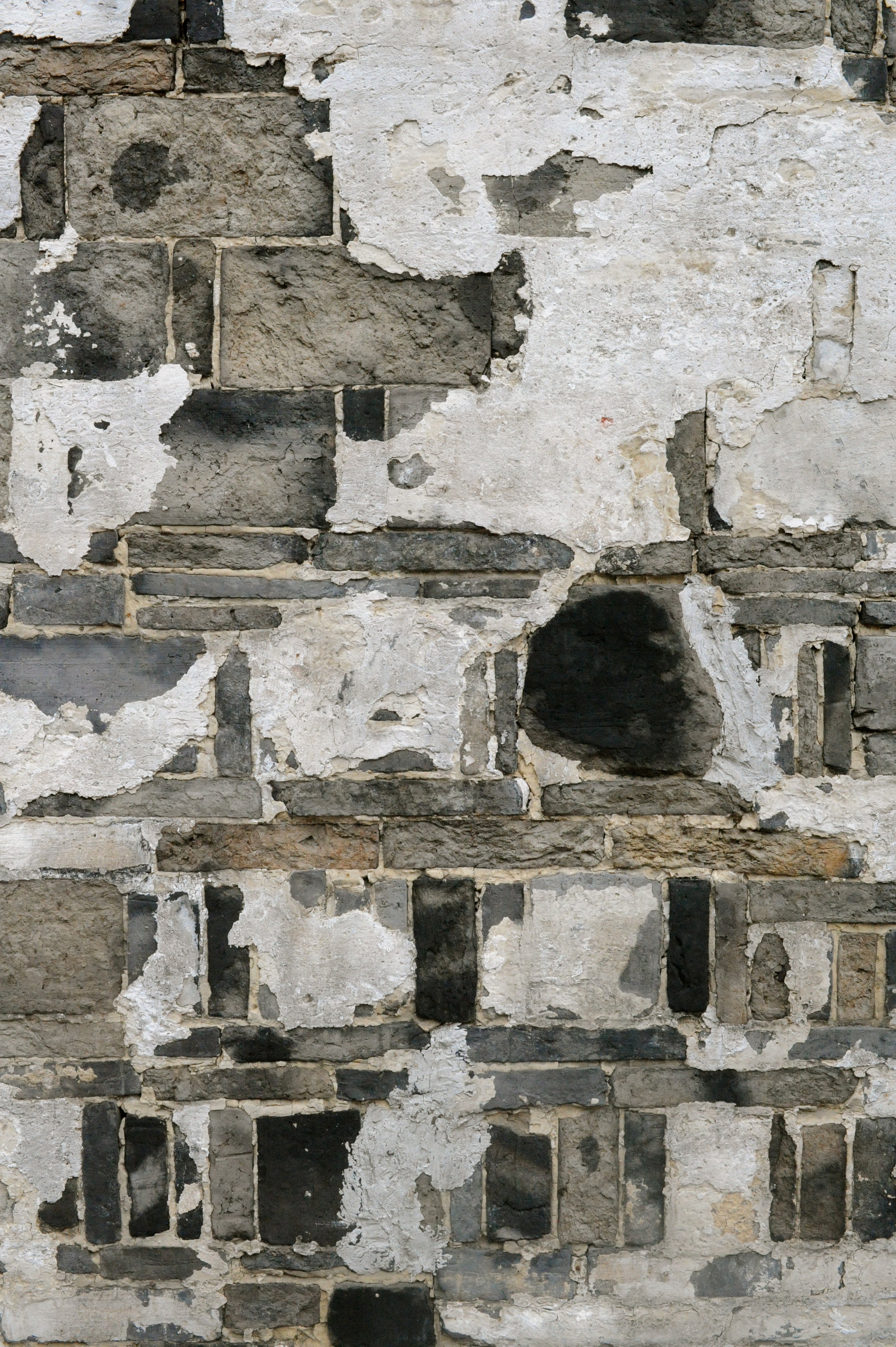 Gorgeous stonework creeps through the aging stucco.