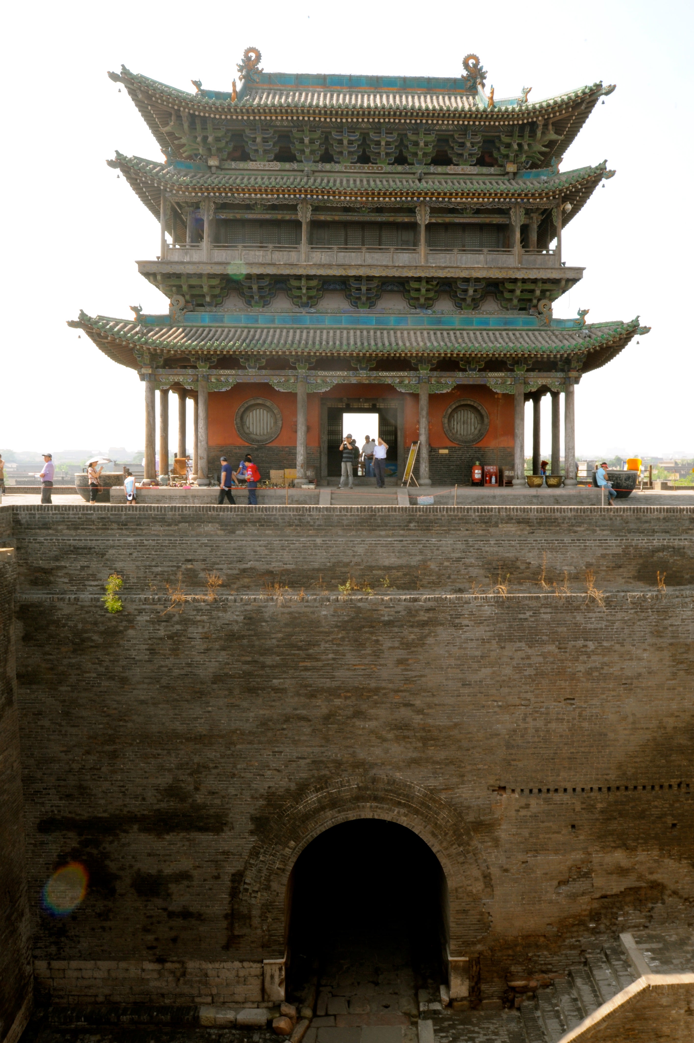 Delicate towers contrast sharply with fortified base.
