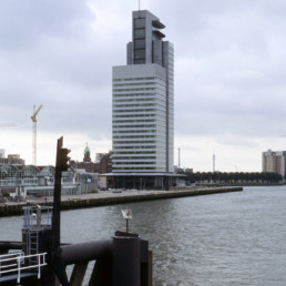 Norman Foster + Partners World Port Center Skyscraper in Rotterdam Netherlands on a cloudy day photographed by Larry Speck, UTSOA