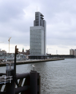 Norman Foster + Partners World Port Center Skyscraper in Rotterdam Netherlands on a cloudy day photographed by Larry Speck, UTSOA