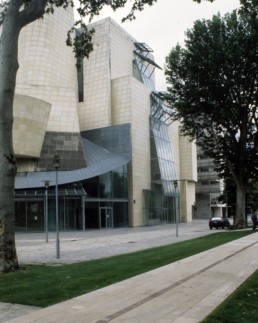 Frank Gehry American Center in Paris now home to the Cinémathèque Française, by architect Frank Gehry, photographed by Larry Speck of University of Texas at Austin School of Architecture UTSOA. Cloudy day.