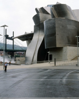 Guggenheim Art Museum in Bilbao Spain by Architect Frank Gehry photographed by Larry Speck on a cloudy day. Exterior titanium skin.
